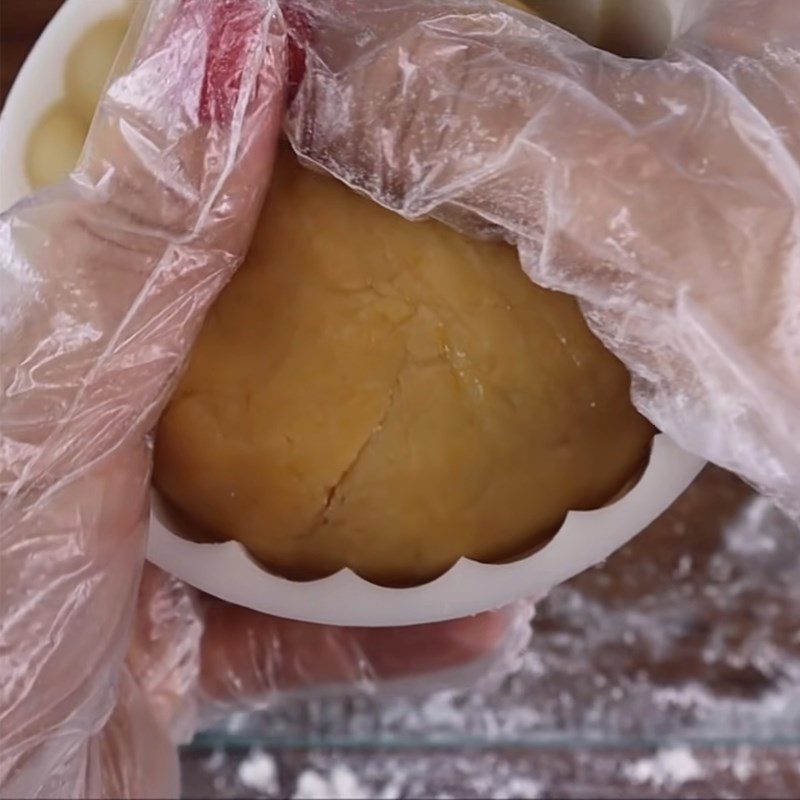 Step 6 Shaping the Moon Cake with black sesame and salted egg