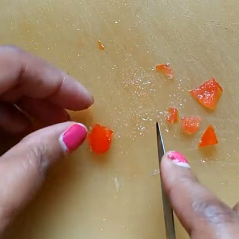 Step 1 Carve tomato for snowman from rice