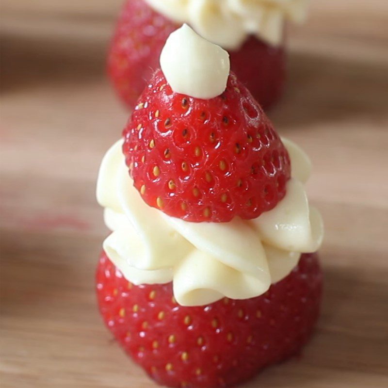 Step 3 Decorating Snowman made from strawberries and whipped cream