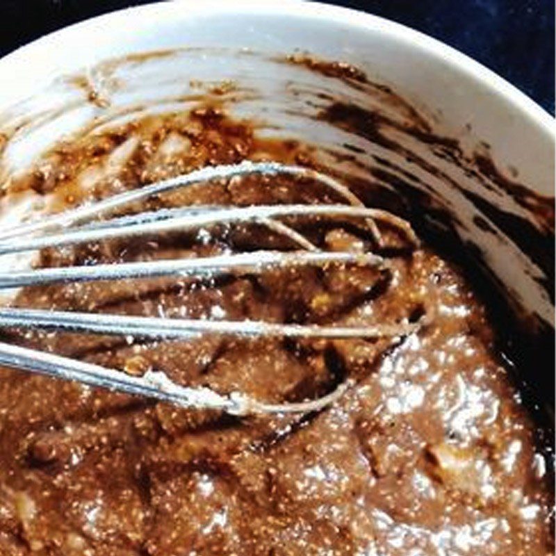 Step 2 Mix the dough for banana oatmeal cake with cocoa and cheese