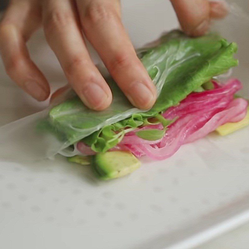 Step 5 Roll the salad Salmon avocado spring rolls