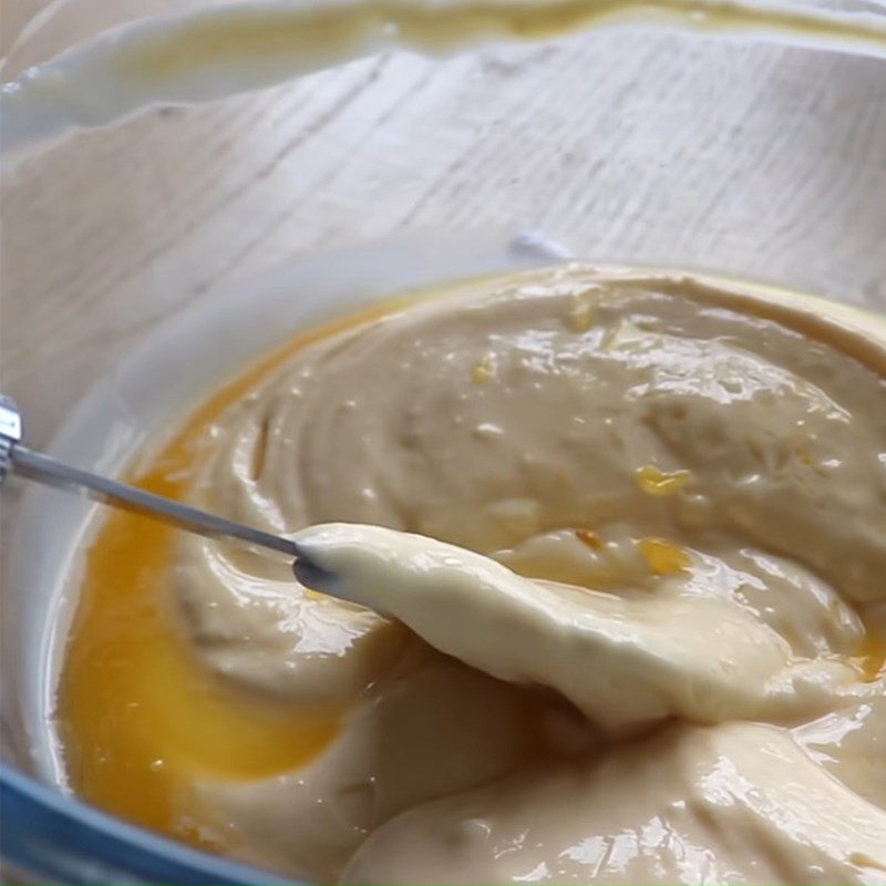 Step 3 Mixing the cheese mixture for baked orange cheesecake with flour