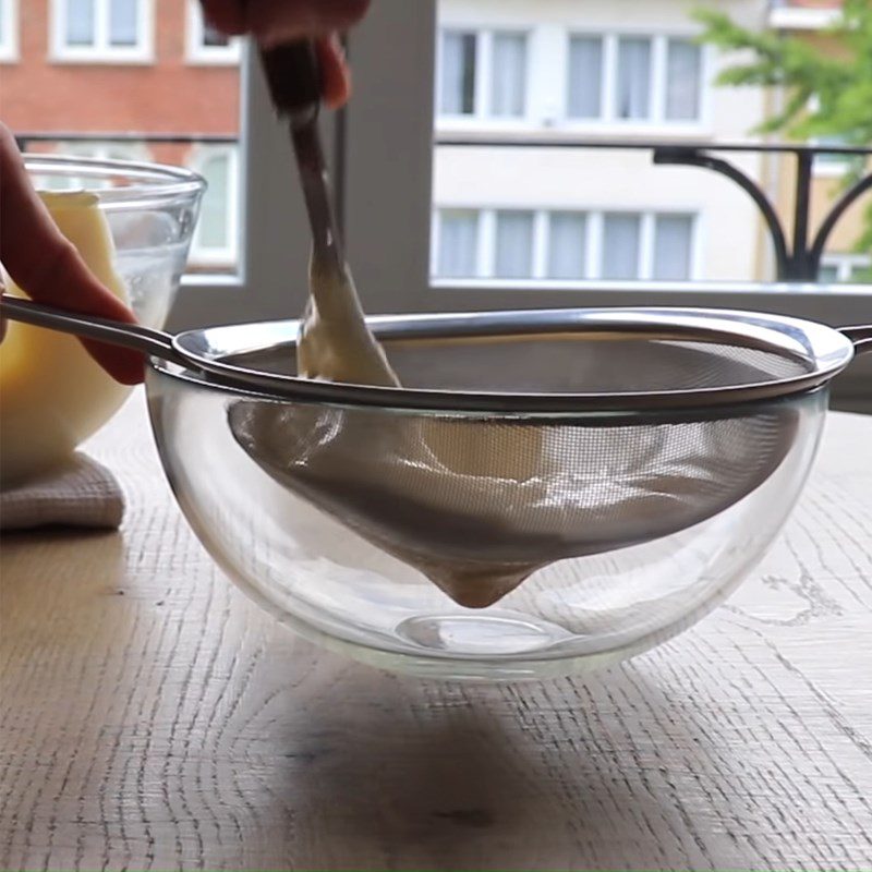 Step 3 Mixing the cheese mixture for baked orange cheesecake with flour