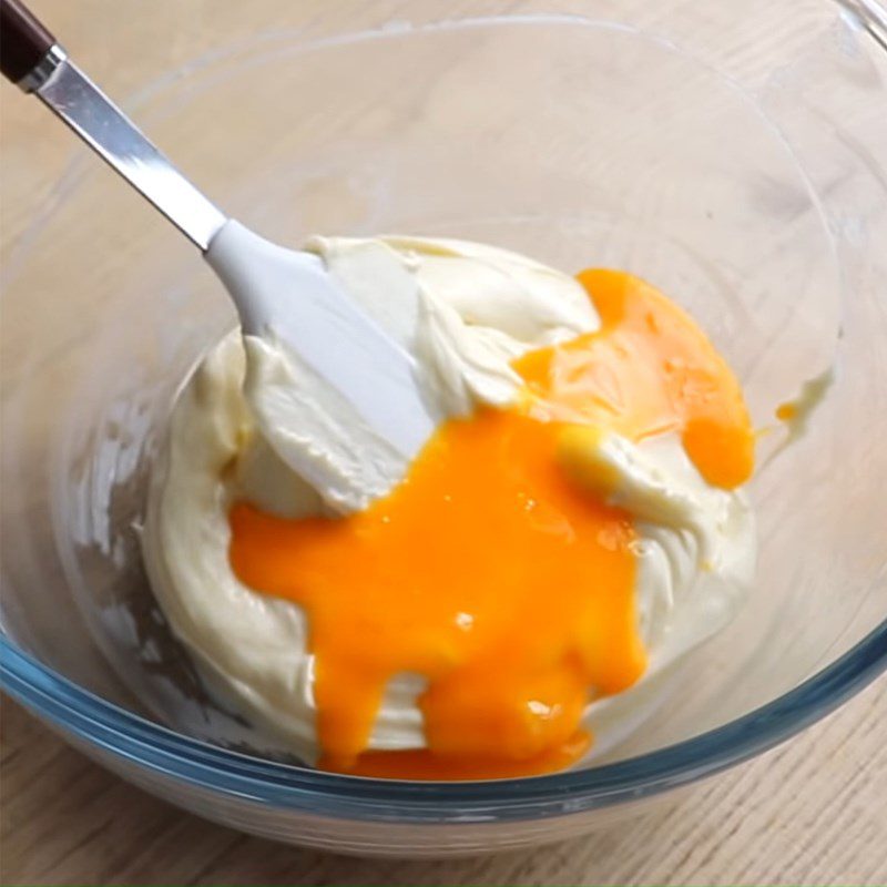 Step 3 Mixing the cheese mixture for baked orange cheesecake with flour