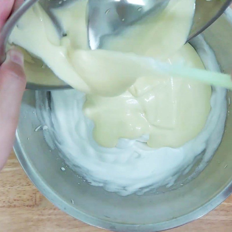 Step 3 Mix egg whites with the yolk mixture for the sponge cake with raisins