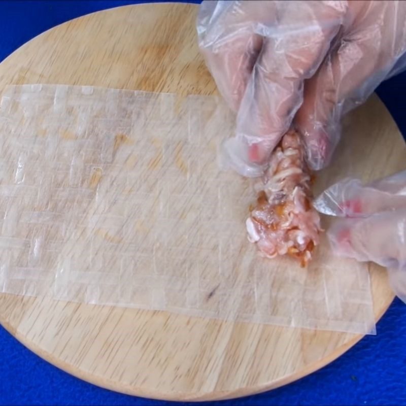 Step 4 Mixing the filling and wrapping the spring rolls Noodles with soy sauce, pork, and egg roll