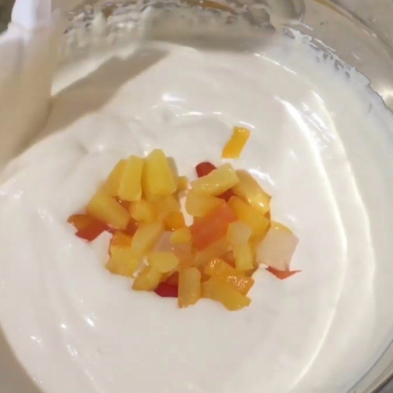 Step 2 Mix cocktail fruits with cream