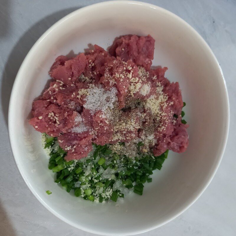 Step 2 Mix, marinate the meat and stuff the filling Steamed stuffed gourd