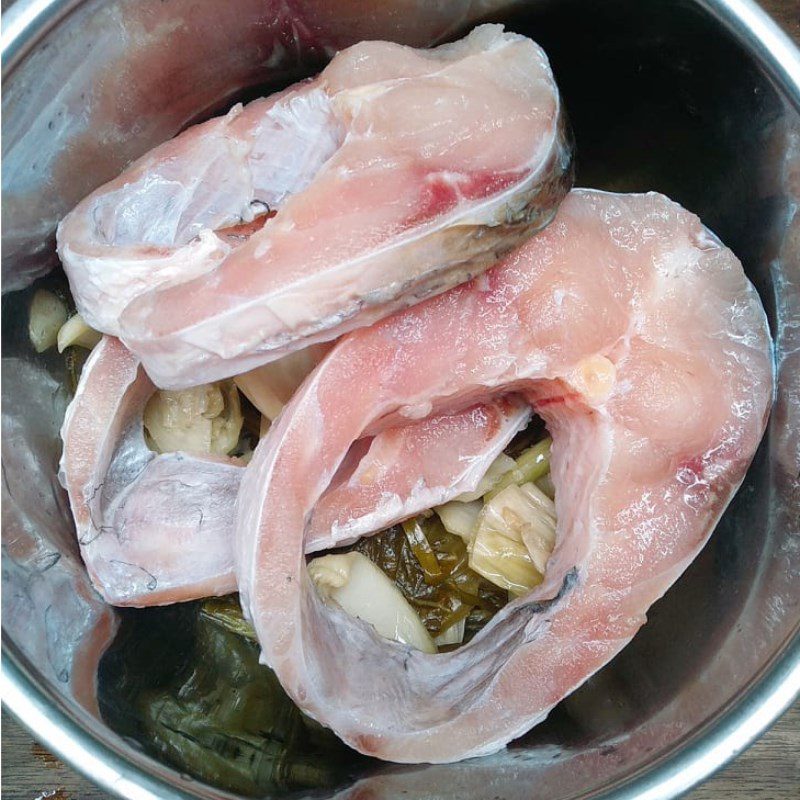 Step 2 Marinate the fish Braised Snakehead Fish with Pickled Mustard