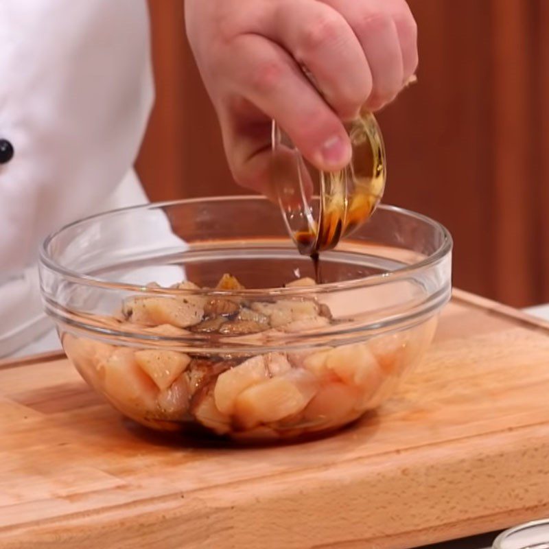 Step 2 Marinate the chicken with spices for Spicy Stir-Fried Chicken Kung Pao in a Western Style