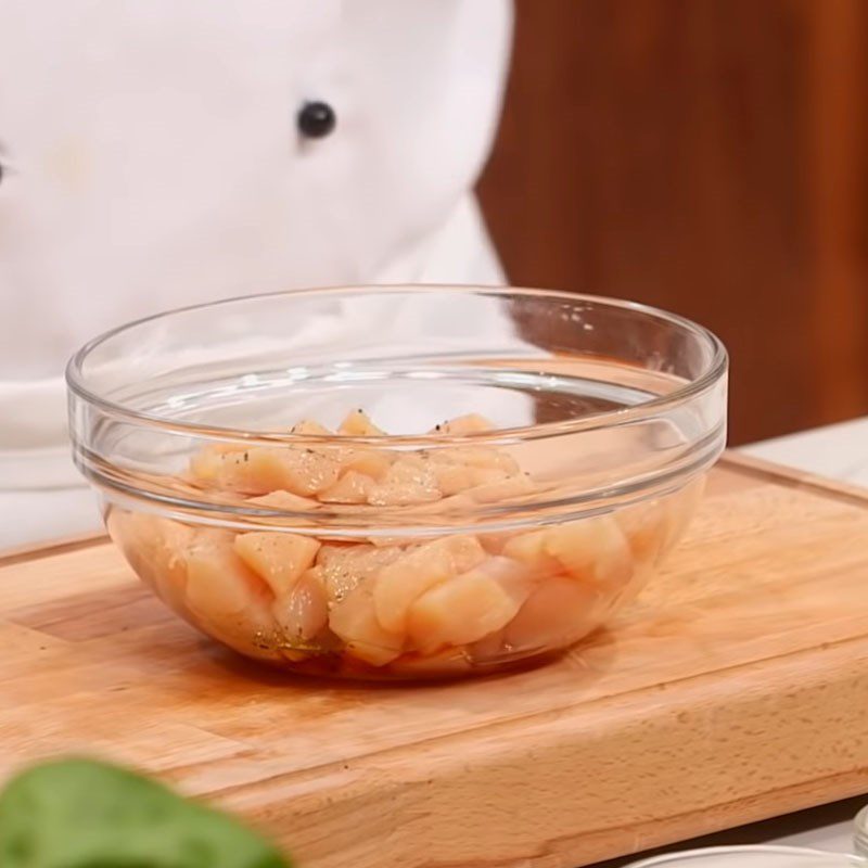 Step 2 Marinate the chicken with spices for Spicy Stir-Fried Chicken Kung Pao in a Western Style