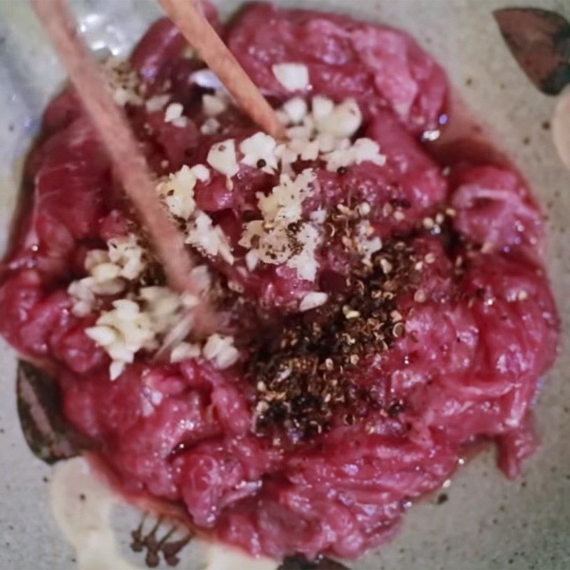 Step 2 Marinate buffalo meat Buffalo meat stir-fried with lolot leaves