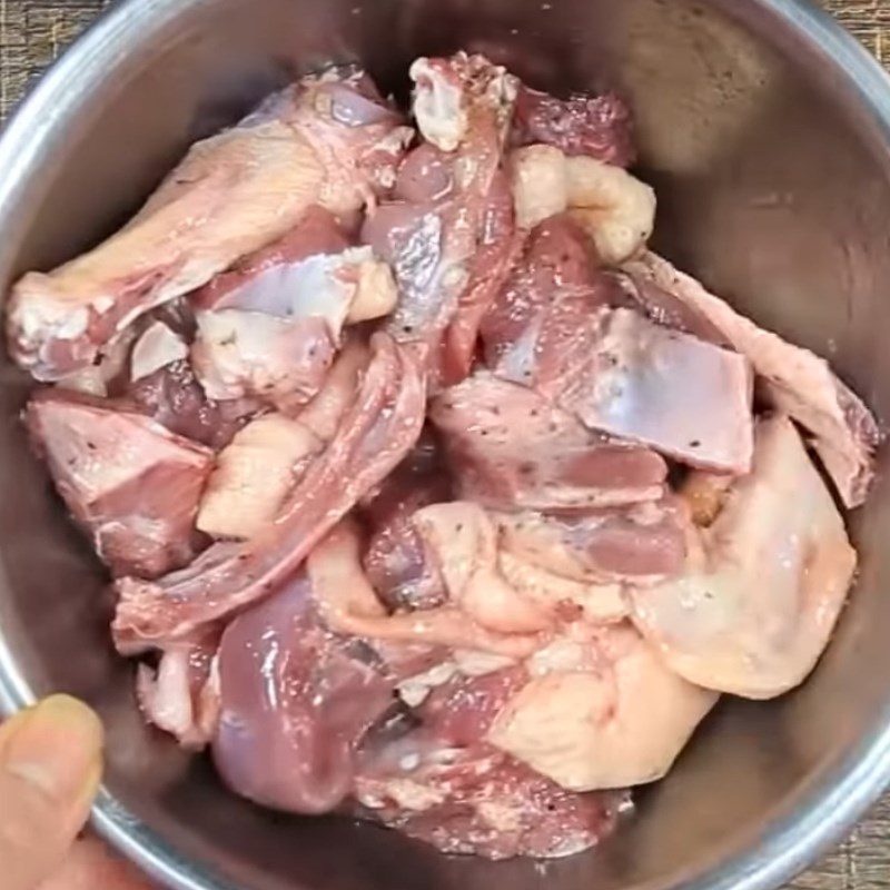 Step 2 Marinate the duck meat for Duck with green bananas