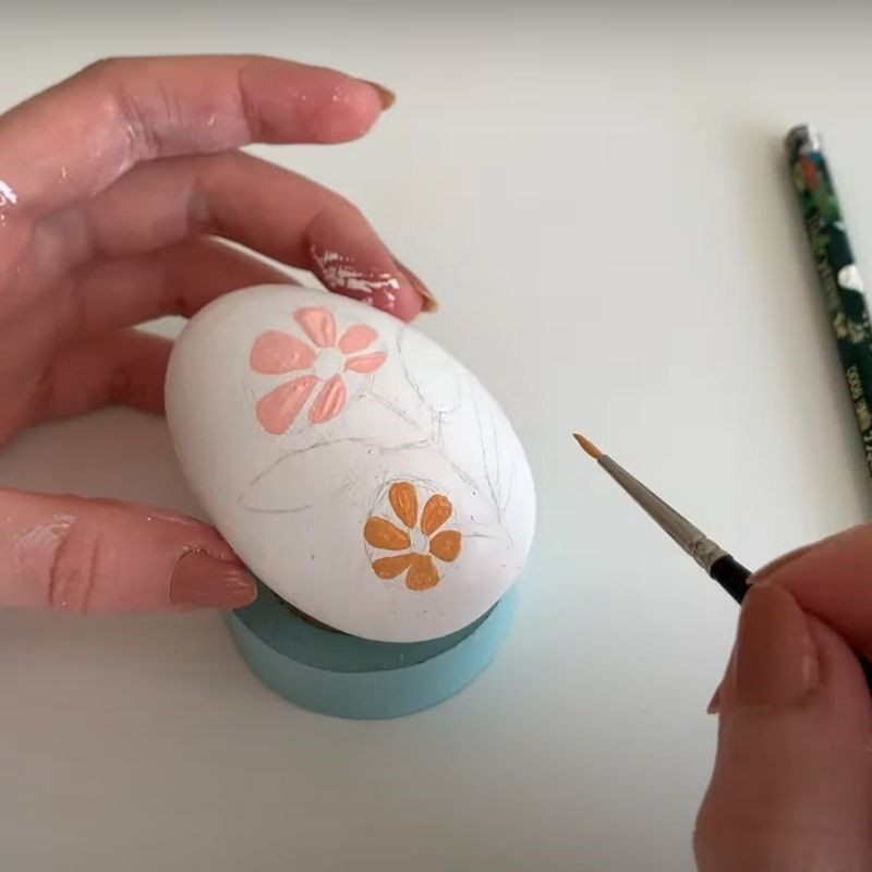 Step 2 Draw shapes Decorate the colored eggs with paint