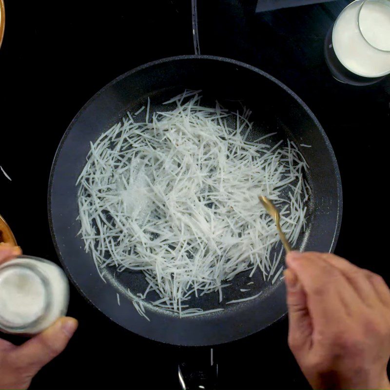 Step 2 Sauté coconut and cook coconut milk Sticky rice with lotus seeds and chicken fat