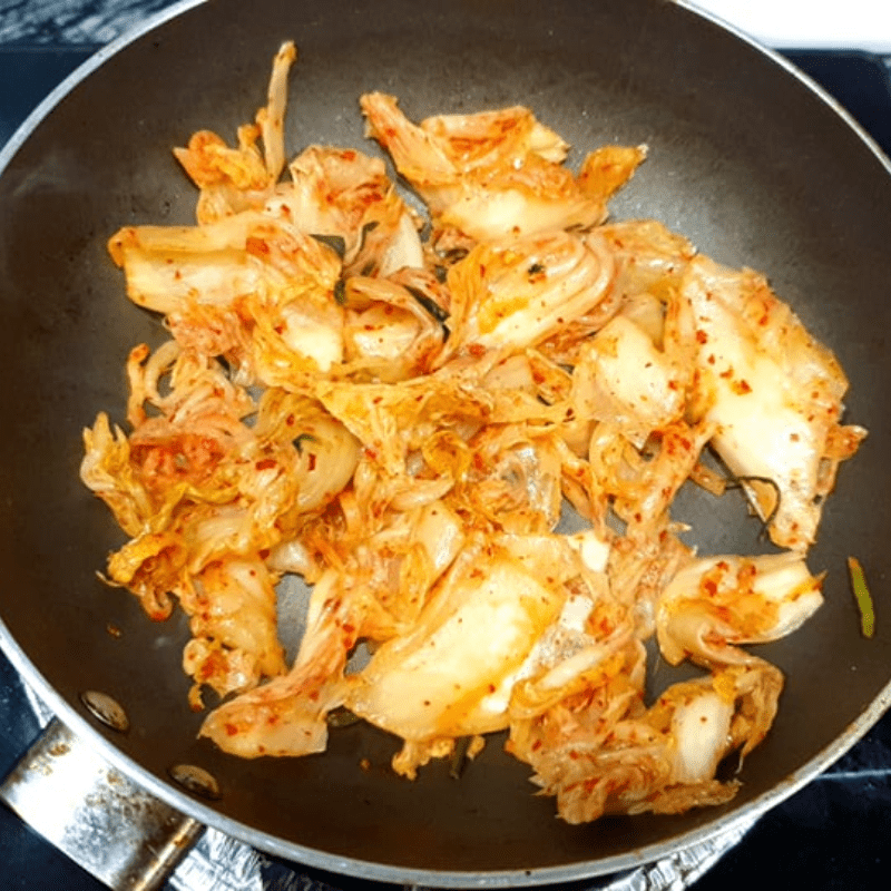 Step 2 Sauté ingredients for Kimchi Oyster Soup