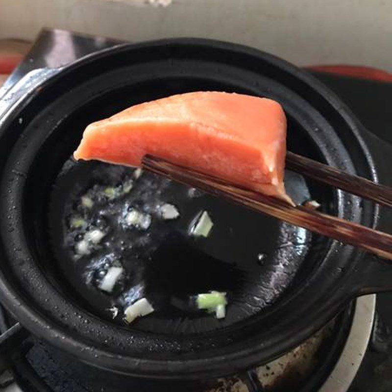 Step 2 Sauté the ingredients Salmon and soft tofu porridge