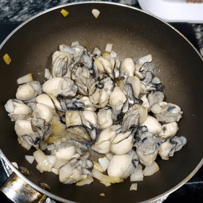 Step 2 Sauté ingredients for Kimchi Oyster Soup