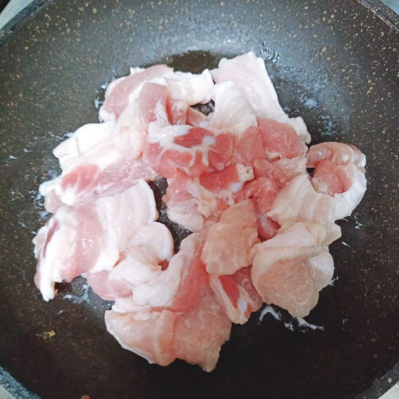 Step 2 Sauté the meat Pork sauté with king oyster mushrooms