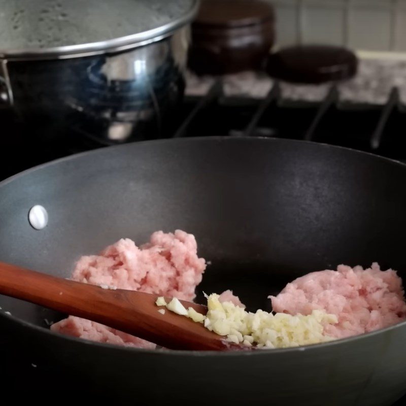 Step 1 Sautéing pork for meat Mandu