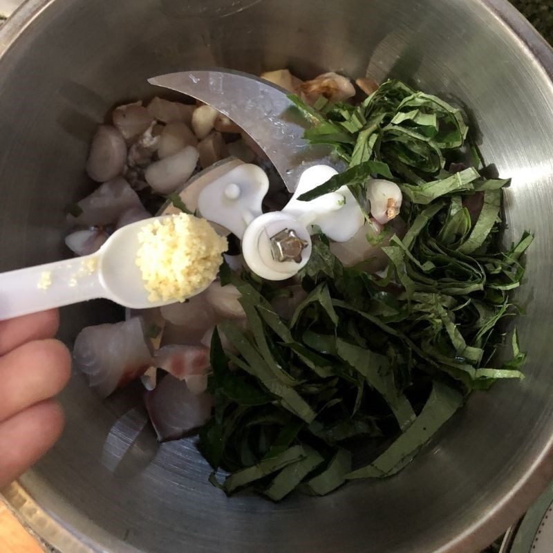 Step 2 Grinding the filling Fish cake with betel leaves