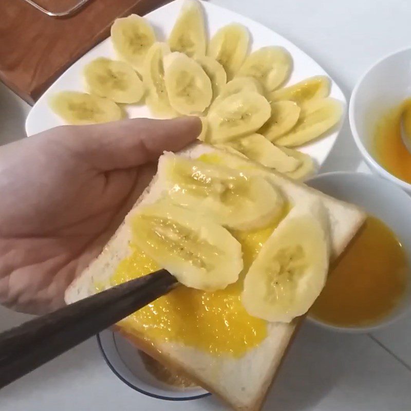 Step 2 Layer ingredients on the bread Grilled banana sandwich with butter