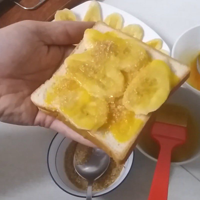 Step 2 Layer ingredients on the bread Grilled banana sandwich with butter