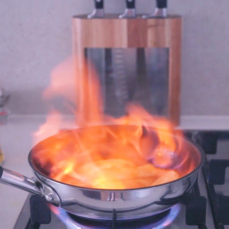 Step 3 Searing bananas and flambéing with orange-flavored rum