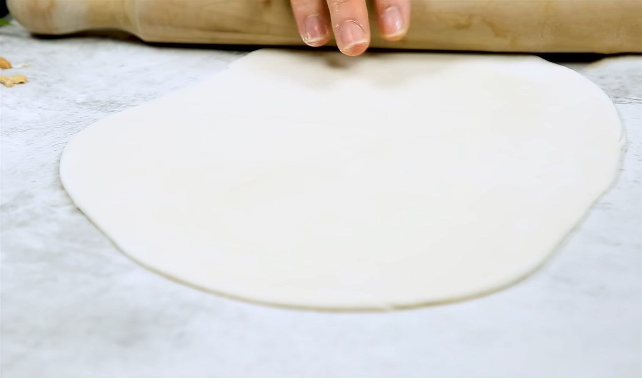 Step 2 Rolling the dough to make noodles Durian noodles