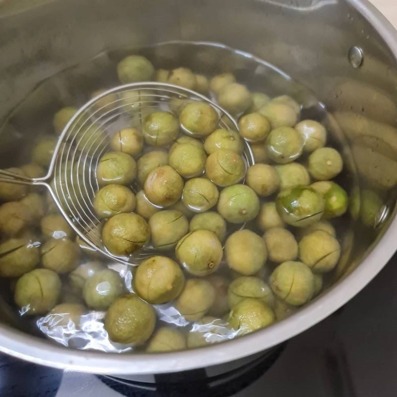 Step 2 Blanch the sour fruits and prepare the sugar water Sour fruits soaked in sugar