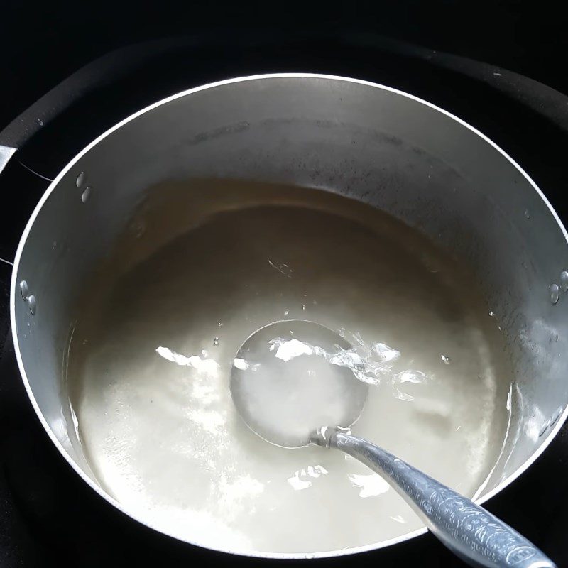 Step 6 Cooking the syrup for Gac sticky rice balls with durian filling