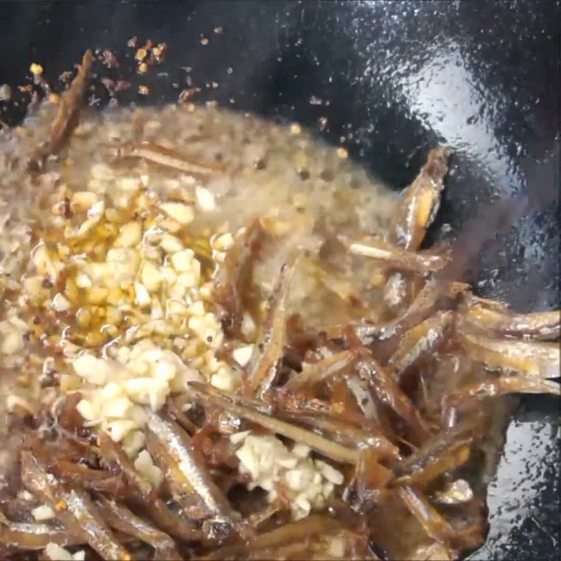 Step 3 Frying anchovies with garlic fish sauce and chili powder Dried anchovies fried with fish sauce