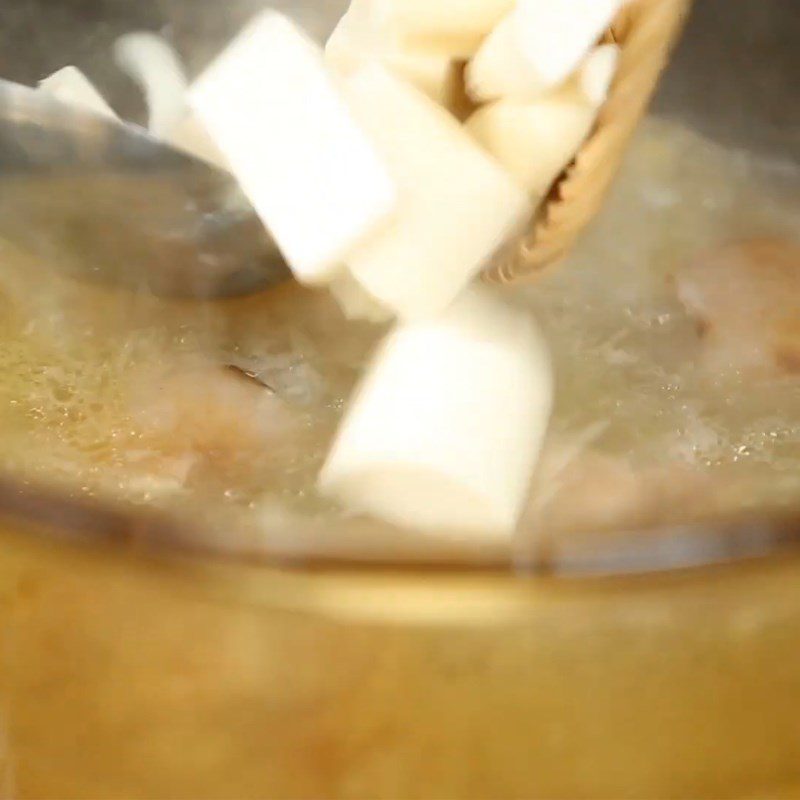 Step 5 Add the porridge to cook together with the beef tail Beef tail porridge