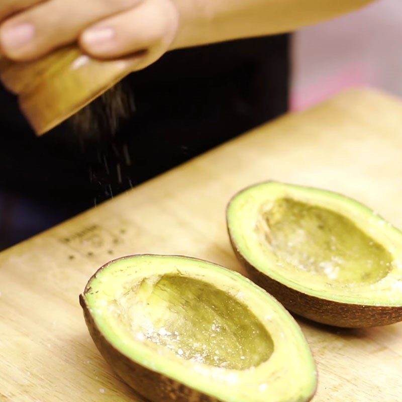 Step 2 Add the egg to the avocado for baked avocado with cheese and egg