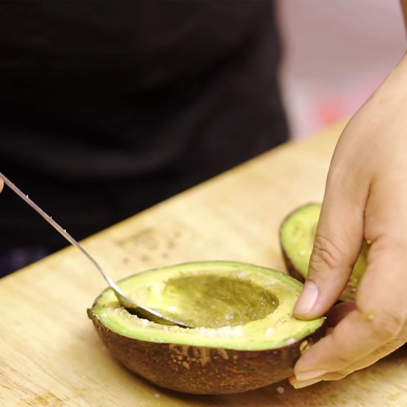 Step 2 Add the egg to the avocado for baked avocado with cheese and egg