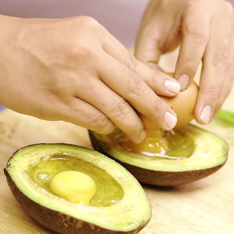 Step 2 Add the egg to the avocado for baked avocado with cheese and egg