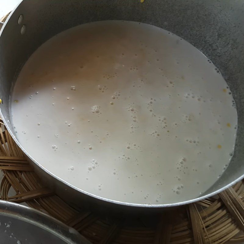 Step 2 Prepare the coconut milk and cook the mung beans for the Gấc sticky rice cake filled with durian