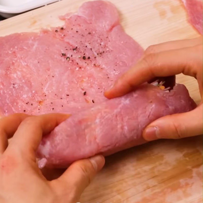 Step 4 Roll the meat Pork rolled with cheese and fried ham