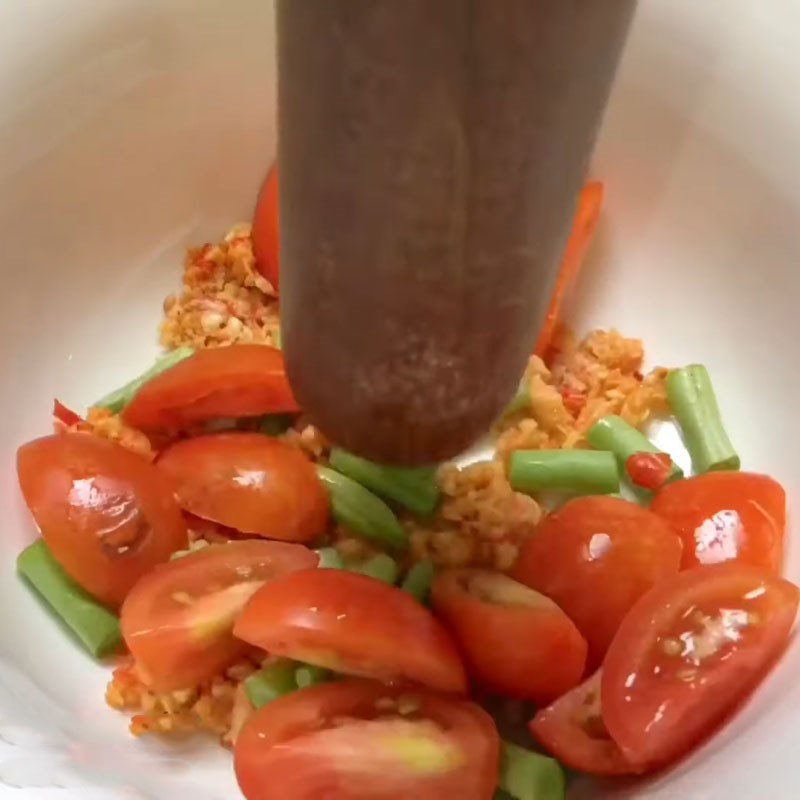 Step 3 Pound tomatoes and green beans with the garlic chili cashew mixture for Carrot Salad