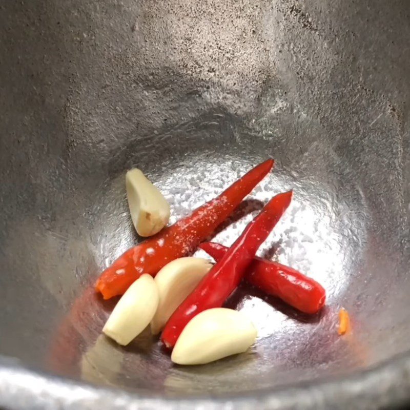 Step 2 Pound cashews with garlic and chili for Carrot Salad