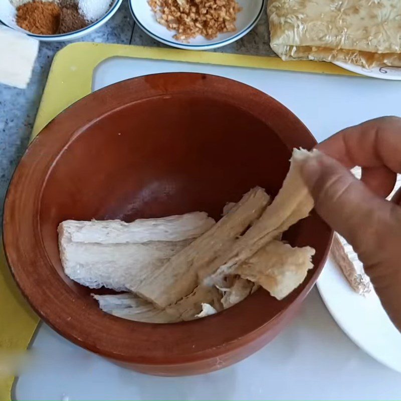 Step 2 Pound pork ribs and tofu for vegetarian sausage from pork ribs and white tofu