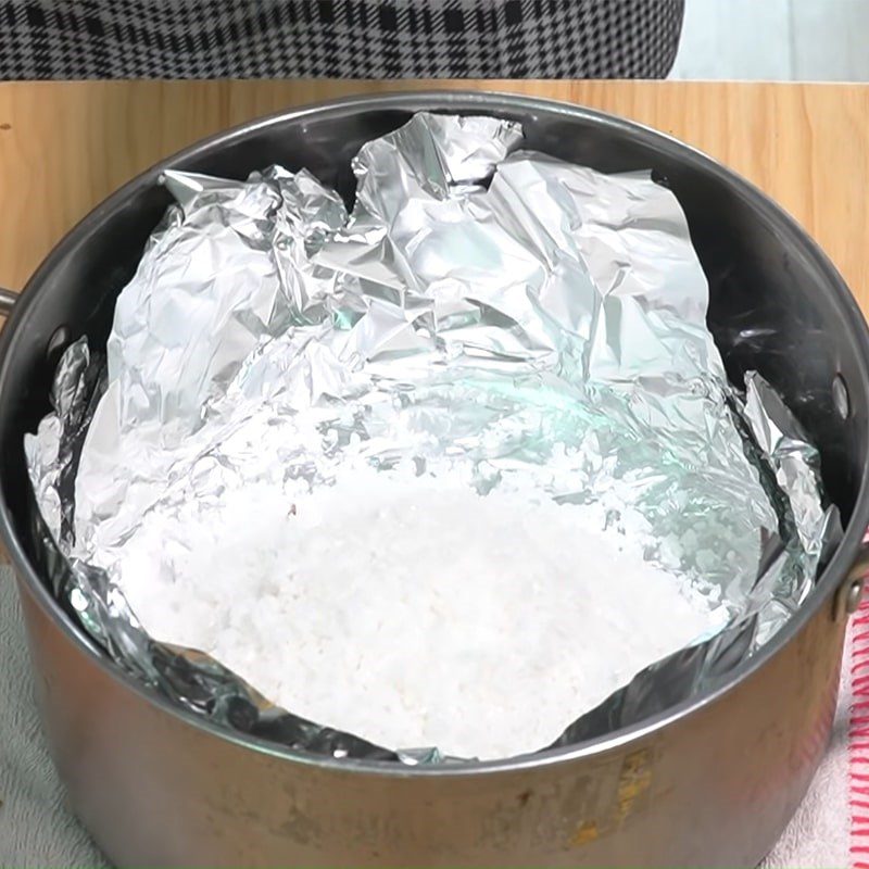 Step 4 Steaming the chicken Chicken wrapped in foil steamed with salt