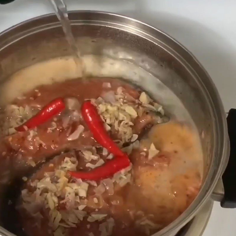 Step 4 Cook the fish Salmon cooked in coconut water
