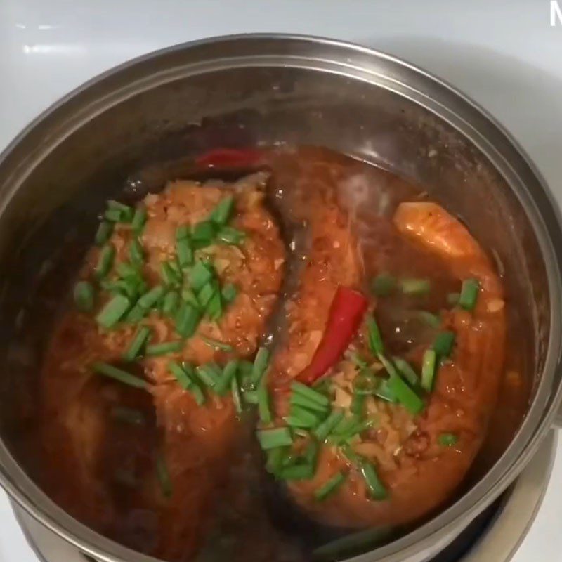 Step 4 Cook the fish Salmon cooked in coconut water