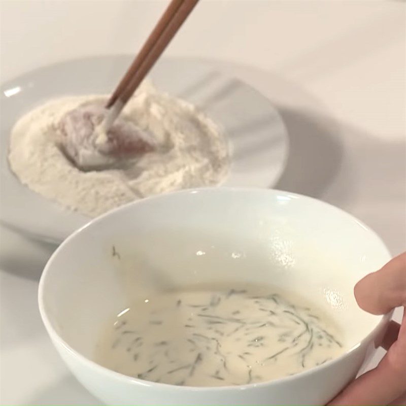 Step 4 Dip in batter and fry the fish Crispy pomelo fish with basil leaves