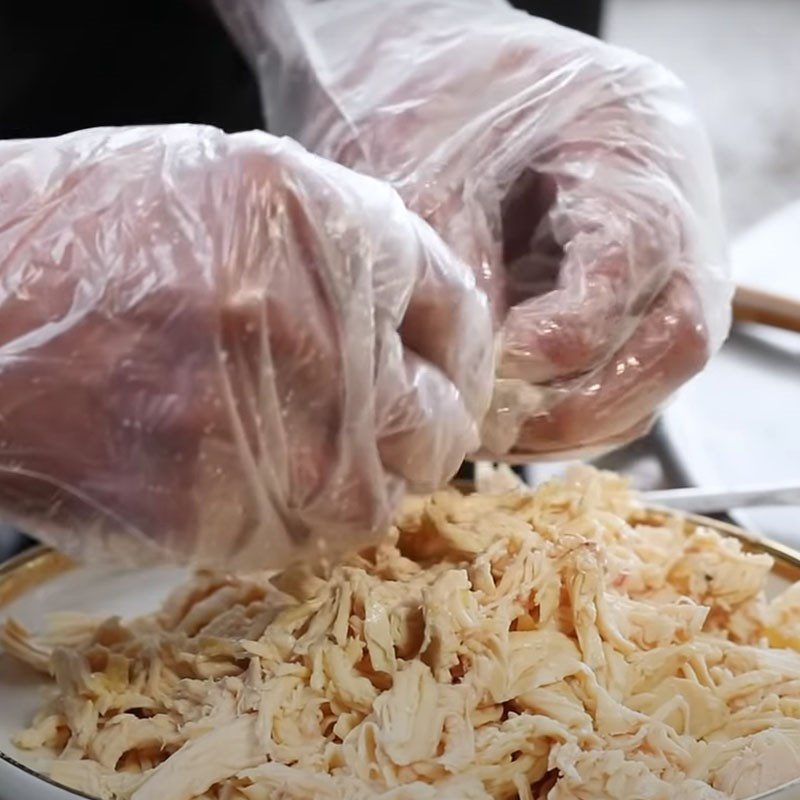 Step 2 Boil the chicken and shred it Crispy fried chicken rolled in pandan leaves