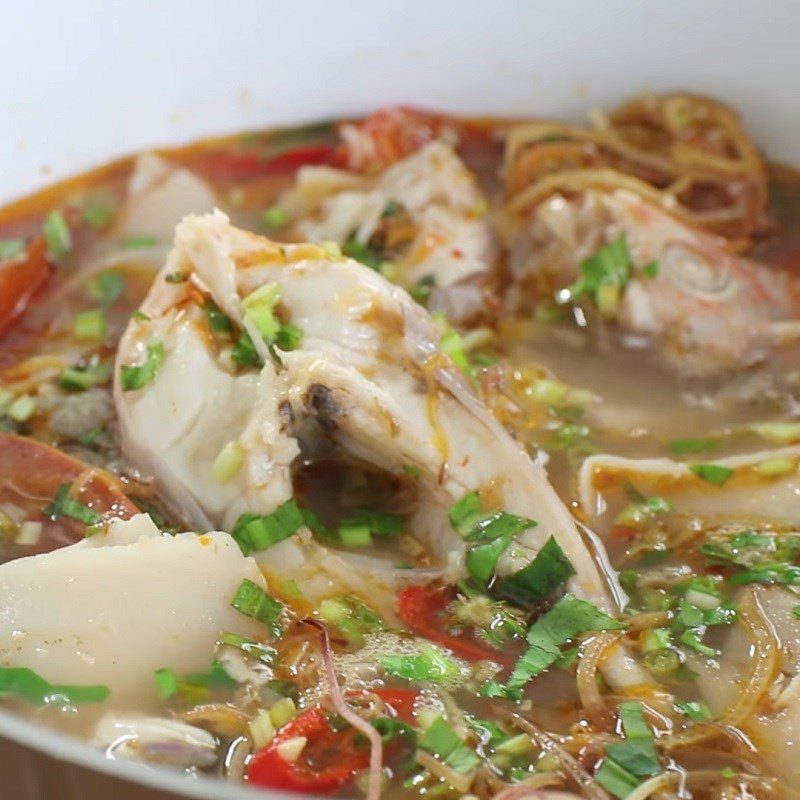 Step 5 Cooking soup Sour bamboo soup with red tilapia