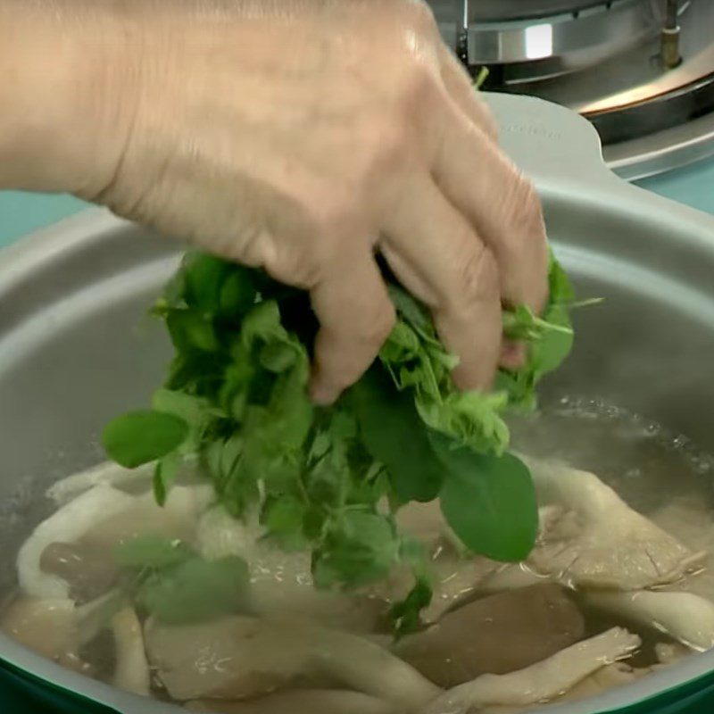 Step 3 Cook the soup for Abalone Mushroom Soup with Moringa