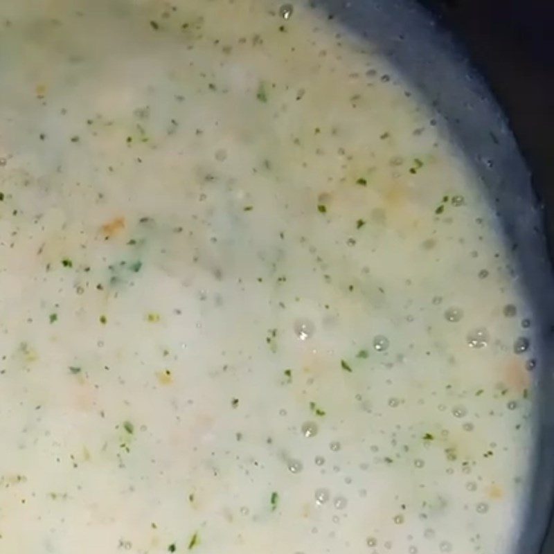 Step 3 Cook squid porridge with carrot and mustard greens