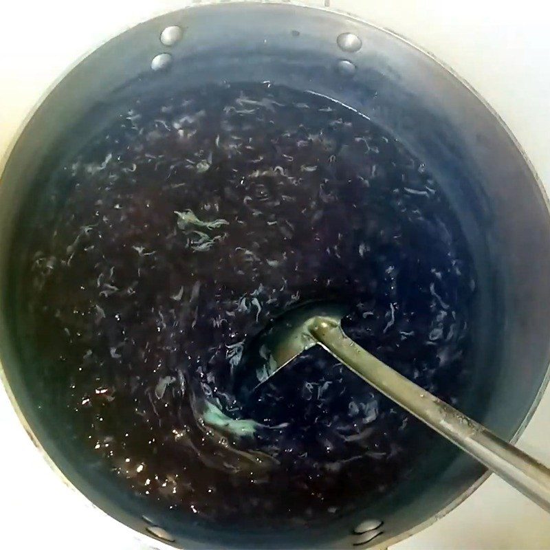 Step 5 Cooking porridge with eggs and milk Purple sweet potato egg porridge